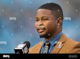 NFL Network's Cameron Wolfe works before an NFL football game between the  Carolina Panthers and the Washington Football Team Sunday, Nov. 21, 2021,  in Charlotte, N.C. (AP Photo/Rusty Jones Stock Photo