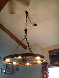 60 Wagon Wheel Chandelier On Chain And Pully Diy Chandelier Rustic Porch Lighting Wagon Wheel Chandelier