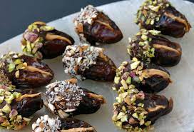 Peanut Butter Stuffed Chocolate Covered Dates This Healthy Table Recipe Date Recipes Desserts Chocolate Dates Recipe Food Garnishes
