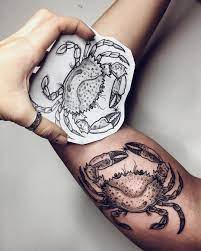 An all black ink tattoo never fails to represent the true spirit. Crab Tattoo Crab Tattoo Cancer Tattoos Cancer Zodiac Tattoo