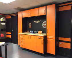 Orange is a difficult color to blend, so better rock it with neutrals, eggplant, bold and dark shades or blue and black or grey, be careful with the rest of colors. Create Your Own Custom Garage With Cgc Cabinets From Closet City Harley Davidson Enthusiasts You Ll Garage Storage Cabinets Man Cave Garage Garage Furniture