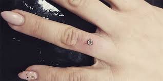 See more ideas about tattoos, tattoo designs, ring finger tattoos. Finger Piercing The Weird New Engagement Ring Trend You Need To Know About