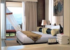 seated on a ridge overlooking the hills of myanmar and laos is an enchanting resort that gives guests some of safari lodge asian interior design unique hotels