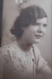 Can someone please add some colour to my auntie's photo. She had lovely  blue eyes and brown hair. Thank you.
