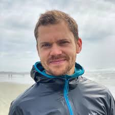 Where is the Ironman store and Ironman village located in relation to  transition at Ironman California?