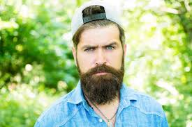 Serious bearded man Mature hipster with beard male facial care brutal man  with beard barber hispter style Fashion portrait of man Hair beard care guy  in wood summer camping Indulge yourself |
