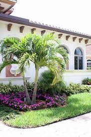 Love the varying heights and colors of this pollinator border. 19 Landscaping With Palm Trees Ideas In 2021 Front Yard Landscaping Florida Landscaping Yard Landscaping