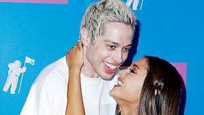 The singer, who got engaged to dalton in december, casually posted a romantic black and white photo on instagram of them locking lips on their big day with her veil just. Ariana Grande Pete Davidson Married His Bracelet Has Fans Freaking Hollywood Life