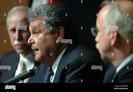 Technical Panel Lead Joe Cuzzupoli, center, gives his remarks with Richard  Covey, left, and Col. Jim Adamson at the final public meeting of the Return  To Flight Task Group led by Thomas