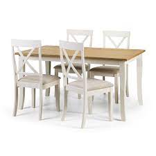 White round dining table with 4 pink velvet dining chairs. Davenport Rectangular Dining Table And 4 Chair Set