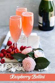 Raspberry Bellini Fresh Raspberries Champagne A Little Sugar And Lemon Juice Are All You Need For Raspberry Bellini Fruity Cocktail Recipes Fruity Cocktails