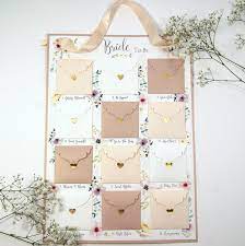 Form the shape of a christmas tree with open a numbered window for each december day before christmas. The Bride To Be Advent Planning Calendar Shop Online Hummingbird Card Company