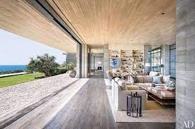 Large glass garage doors open this living room to the outdoors. 12 California Homes Designed For Indoor Outdoor Living Architectural Digest