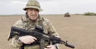 Yevgeny Prigozhin in Africa - showing off a customized AKM with a chopped  down barrel : r/ForgottenWeapons