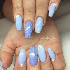 On one accent nail use gold, white, and black design that mimics spaceships and the futuristic tailored suits of their captain. Coffin Light Blue Baby Blue Nails Novocom Top