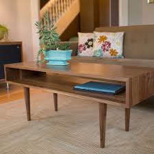 A wooden centre table will complement a wide variety of furnishings and will add warmth to your space. Top 10 Modern Coffee Tables Living Room Designs At Ylighting
