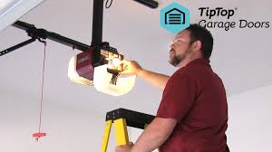 Adjust the spring or the cable until the door is well balanced and does not drop shut or spring open too quickly. How Do I Adjust The Force On My Garage Door Tip Top Garage Doors
