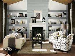 Terracotta design build grounds the light walls and drapery with a dark red area rug and gray arm chairs, while the gold accents pop throughout the space. Gray Color Palette Gray Color Schemes Hgtv