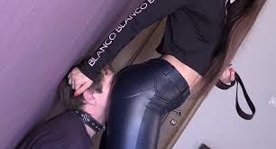 Femdom mistress makes him adore that leather ass