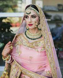 Pink Gold And Green Accents This Is A Classic Look In Punjab Love Her Makeup Too Indian Bridal Indian Bride Indian Bridal Fashion