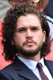 It appears that he does not part it at all, choosing instead to simply comb it back and to the right. Kit Harington S Jon Snow Length Hair At Wimbledon Sets Off New Speculation Kit Harington Curly Hair Men Mens Hairstyles