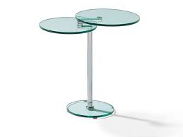 A month ago my wife, two kids and i were going through a furniture store when i noticed a really cool coffee table which had a table top that swivelled upwards to create a quasi desk type table. Adjustable Round Glass Coffee Table Gonzales By Ronald Schmitt Design Matthias Fischer