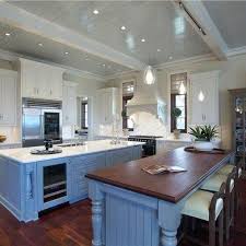 Traditional kitchen features a thermador island cooktop with double ovens under a range hood and a brown wooden island topped with white quartz. 37 Secrets About Brazilian Kitchen Ideas Exposed Homedesa Com White Kitchen Design Cottage Style Kitchen Kitchen Design
