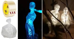 If you're placing these packing tape ghosts in your front yard, make them even more spooky with some lights. Diy Halloween Decor Idea Packing Tape Ghosts