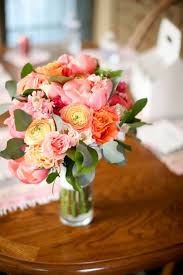 Orange bridal bouquets attract attention. A Vibrant Spring Time Wedding Allium Floral Design
