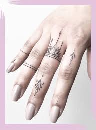 Minimalists And Tattoo Lovers Alike Find Tiny Tattoos Irresistible But It S Also True That Finger Tattoos Have Tattoos For Lovers Tattoos Girl Finger Tattoos