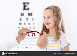 Child At Eye Sight Test Kid At Optitian Eyewear For Kids