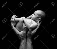 Maybe you would like to learn more about one of these? Fine Art Image Of A Father S Hands Holding His Baby Against A Black Background Stock Photo Picture And Royalty Free Image Image 73421630