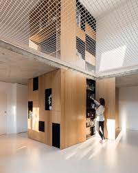 Around The Net A Game Of Solids And Voids The Main Asset Of The House Was Its Light And The Double Height Volume In The Living Room Unex Haus Architektur