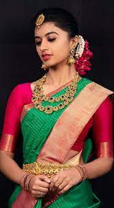 South Indian Bride Indian Bridal Jewelry Temple Jewelry Jhumkis Red And Green Silk Kan Indian Bridal Hairstyles Bridal Hairstyle For Reception Indian Bridal