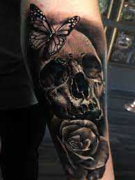 Skull Butterfly Rose Tattoo By Laci Limited Availability At Redemption Tattoo Studio Skull Tattoos For Men Skull Tattoos Tattoos For Guys