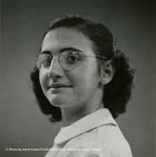 Margo Frank, Anne's older sister, duller and washed out, simple makeup.