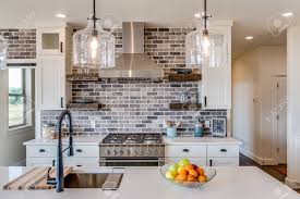 The open kitchen floor plan will conflict with the style of a vintage house. Modern Kitchen With White Cabinets And Open Layout Floorplan Stock Photo Picture And Royalty Free Image Image 148855718