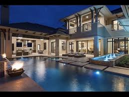 The benjamin's portico leads straight to the foyer with an intricate stepped ceiling. West Indies Inspired Neapolitan Estate In Naples Florida Youtube