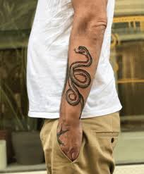 Henna tattoo hand tattoo on snake tattoo tattoo forearm samoan tattoo polynesian tattoos man arm tattoo snake around arm tattoo arm tattoo ideas more information. Snake Tattoo Designs Meanings 2021 Guide Tattoo Stylist