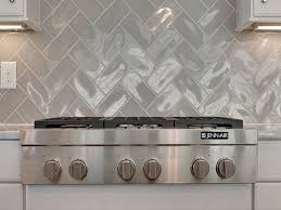 See more ideas about herringbone backsplash, herringbone tile backsplash, kitchen traditional kitchen with white herringbone backsplash and marble countertop island view. Gray Herringbone Kitchen Backsplash Tiles With Jenn Air Stove Transitional Kitchen