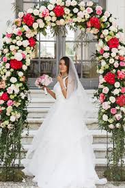 Potted orchids contribute some height to this structure, while exotic leafy plants, like crotons, have deep green leaves and red veins that add intense color. Free Photo Gorgeous Bride Stands Under Wedding Altar Made Of Red And White Flowers