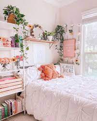 Vibrant bedding in pink tones is offset by a neutral silk and wool gray area rug. Pin On Ideas