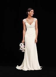 A Simple Wedding Dress Calls For A Simple Wedding Bouquet A Subdued Arrangement Of White Anemon Simple Wedding Bouquets Wedding Dresses Wedding Dresses Simple