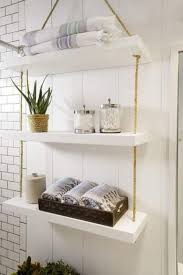 Simple And Smart Bathroom Hanging Shelf With Thick White Shelves And Ropes Bathroom Shelf Decor Diy Bathroom Storage Small Bathroom Storage