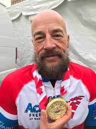 Handcyclists roll through chill to beat disability in Detroit marathon