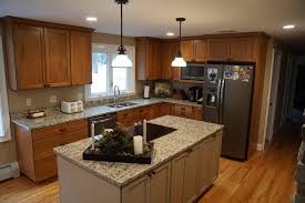 Dark cherry cabinets, uba tuba granite countertops, and neutral colored floor and wall tile. Project Gallery Advanced Kitchens