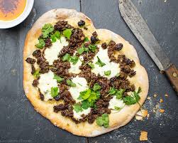 In a large bowl combine oil, tomato paste, parsley, and all spices and stir with a fork. Lebanese Lamb Flatbread Lou S Kitchen Corner