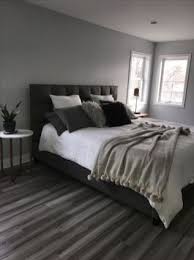 The bed frame and storage cubes on the shelf are a blue jay color. The Fight Against Master Bedroom Grey Walls Dark Furniture Headboards 30 Gray Bedroom Walls Gray Master Bedroom Room Decor Bedroom