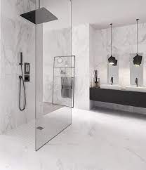 The small but practical vanity features a wide sink set in a marble countertop, as well as a faucet with clean, modern lines. Timelessly Beautiful Noble Modern Xxl Tiles With A Marble Look Baderomdesign Beautiful Marble Accessories Modern Bathroom Design Marble Bathroom