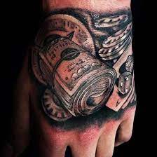 Gambling Money Tattoo On Left Hand Money Tattoo Tattoos For Guys Money Tattoos For Men